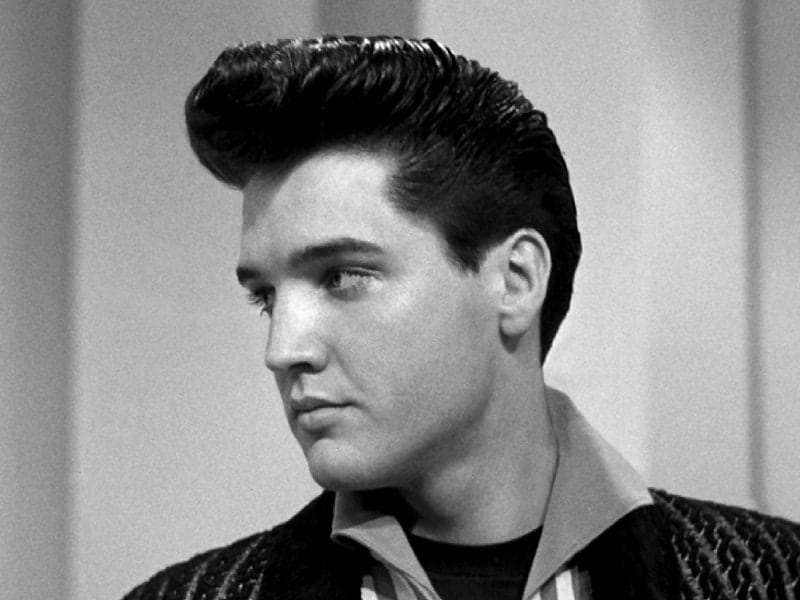 Elevate your look with a pompadour hairstyle, blending classic elegance.